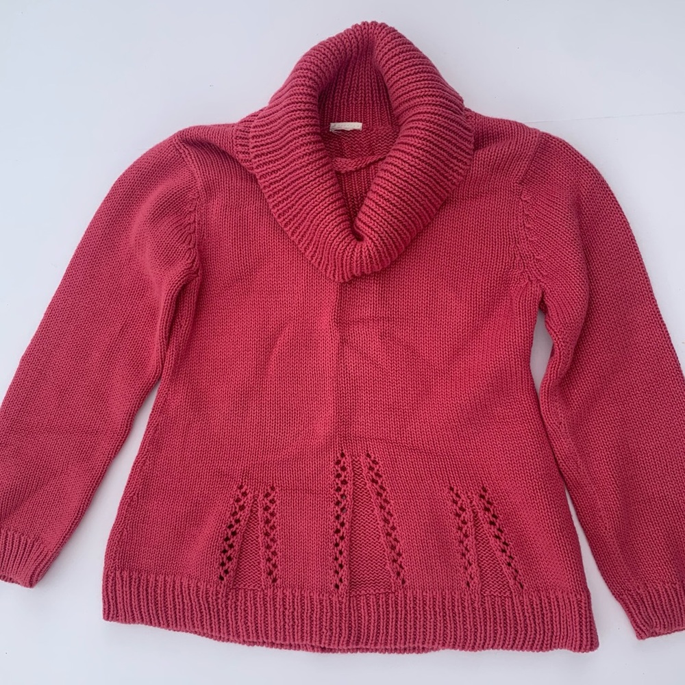 Girls rayon blend turtleneck sweater with swing detail.